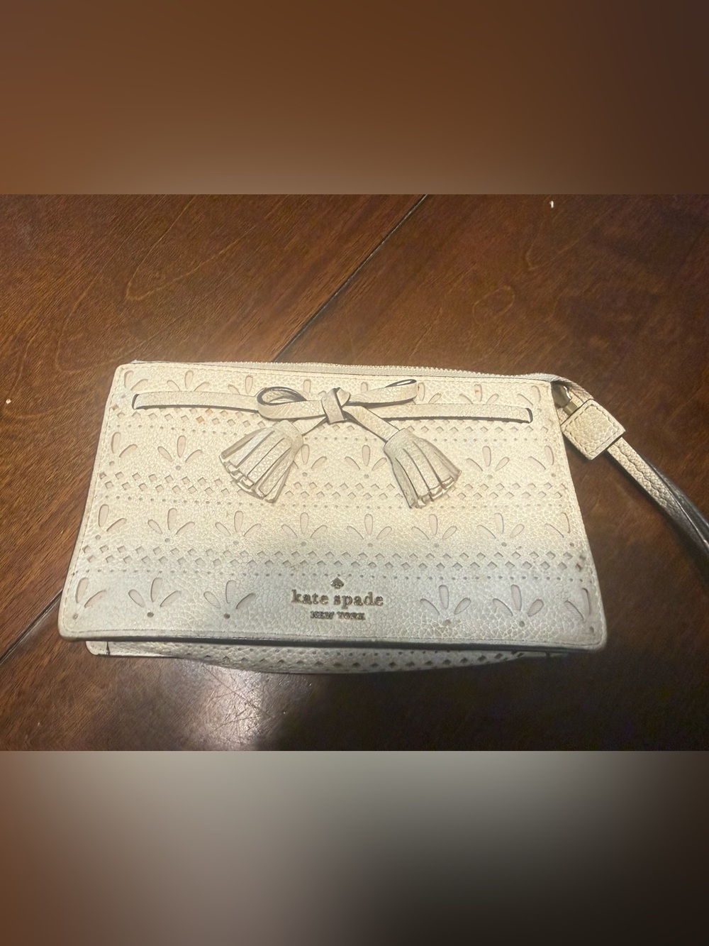 Kate Spade New York Hayes Perforated Leather Tassel Wristlet Clutch Laser Cut